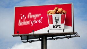 KFC billboard with the slogan “it’s finger lickin’ good” partly blurred out